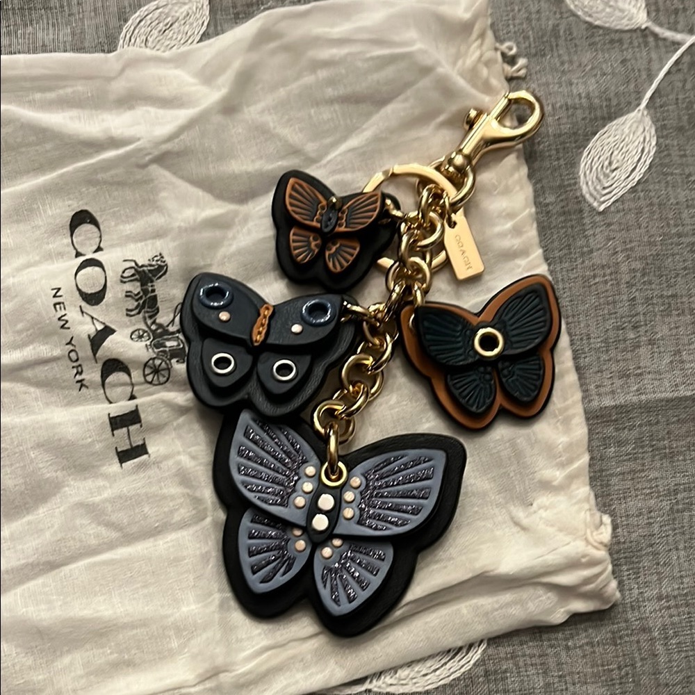 Coach Black and Gold Butterfly Charm